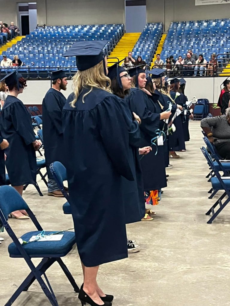 graduates in commencement
